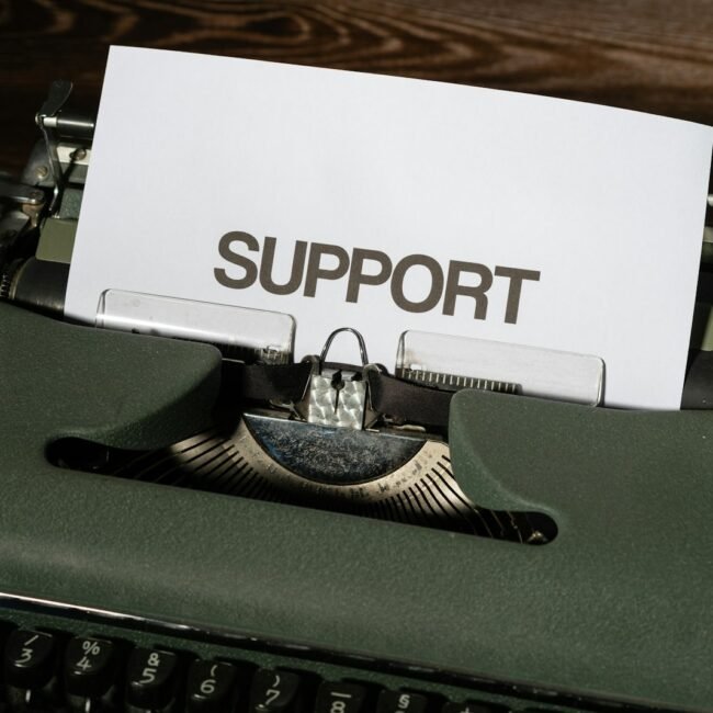 a close up of a typewriter with a paper on it